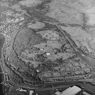 Oblique aerial view centred on the military training camp and farmsteading with oil fuel depots adjacent, taken from the S.