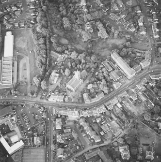 Oblique aerial view of Bothwell centred on St Bride's Parish Church with the Main Street and Russell Memorial Hall adjacent, taken from the WSW.