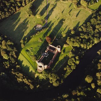 Oblique aerial view of Bothwell centred on the remains of the castle, taken from the WSW.