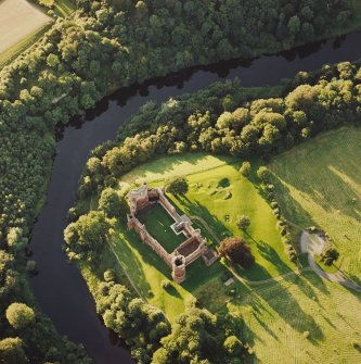 Oblique aerial view of Bothwell centred on the remains of the castle, taken from the SE.