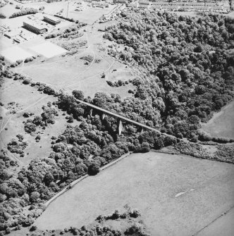 Oblique aerial view centred on the railway viaduct, taken from the WNW.