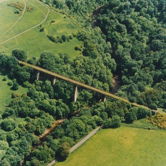 Oblique aerial view centred on the railway viaduct, taken from the WNW.