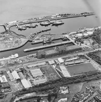 Greenock, James Watt Dock, oblique aerial view, taken from the SW. Cappielow is visible in the centre right of the photograph.