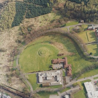 Oblique aerial view centred on the hospital and the garden feature, taken from the NNW.
