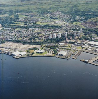General oblique aerial view looking across the harbours, taken from the N.