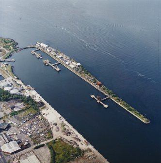 Oblique aerial view centred on the harbour, taken from the SE.