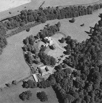 Oblique aerial view centred on the castle, tower-house and stables, taken from the WSW.