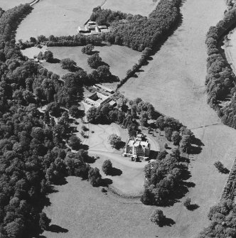 Oblique aerial view centred on the castle, tower-house and stables with the remains of rig adjacent, taken from the ESE.