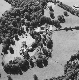 Oblique aerial view centred on the castle, tower-house and stables, taken from the NE.