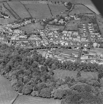 Aerial view of Newmilns railway viaduct and factories, centred on Greenhead Mills, taken from the S.