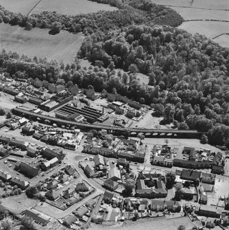 Aerial view of Newmilns railway viaduct and factories, centred on the site of Greenhead Mills, taken from the NNW.