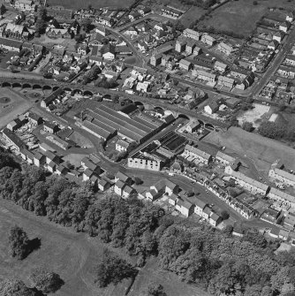Aerial view of Newmilns railway viaduct and factories, taken from the SE and centred on Greenhead Mills, including the site of Darvel Road Hosiery Works.