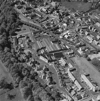 Aerial view of Newmilns railway viaduct and factories, centred on the site of Greenhead Mills, taken from the SE.