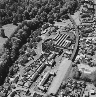 Aerial view of Newmilns railway viaduct and factories, centred on the site of Greenhead Mills, taken from the NE.