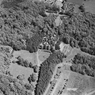 Aerial view of Loudoun Castle, gardens, estate policies and fairground, taken from the WSW.