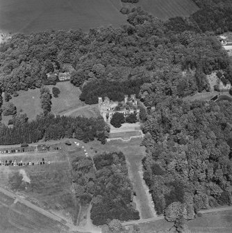 Aerial view of Loudoun Castle, gardens, estate policies and fairground, taken from the SSW.