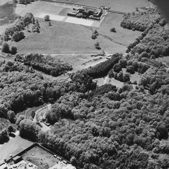 Aerial view of Loudoun Castle, gardens, estate policies and fairground, taken from the NE.