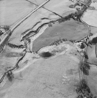 Oblique aerial view centred on the remains of the railway viaduct, taken from the ENE.