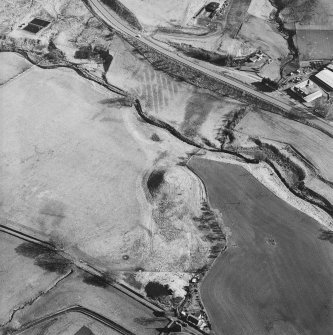 Oblique aerial view centred on the remains of the railway viaduct, taken from the NW.