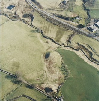 Oblique aerial view centred on the remains of the railway viaduct, taken from the NW.