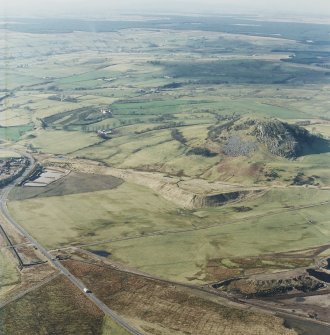 General oblique aerial view looking across Loudon Hill with the railway viaduct and the sand and gravel quarries adjacent, taken from the ESE.