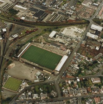 Oblique aerial view centred on the football stadium, taken from the S.