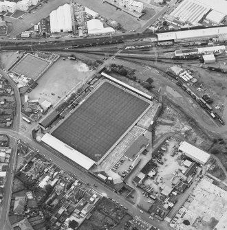 Oblique aerial view centred on the football stadium, taken from the ENE.