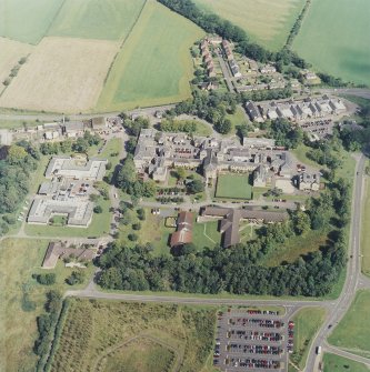 Oblique aerial view centred on the hospital, taken from the SW.