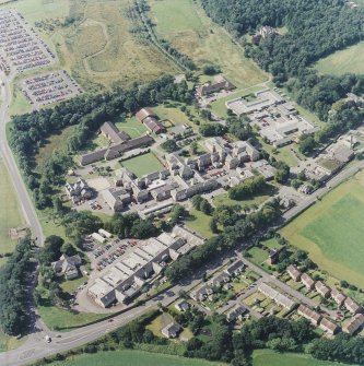 Oblique aerial view centred on the hospital, taken from the ENE.