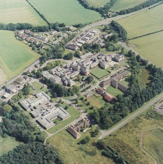 Oblique aerial view centred on the hospital, taken from the WSW.