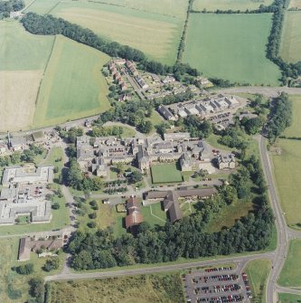 Oblique aerial view centred on the hospital, taken from the SW.