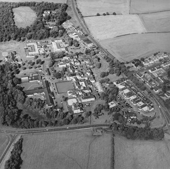 Oblique aerial view centred on the hospital, taken from the SE.