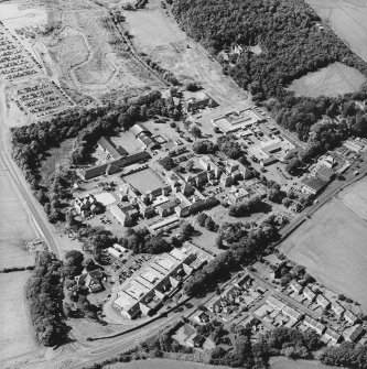 Oblique aerial view centred on the hospital, taken from the ENE.