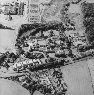 Oblique aerial view centred on the hospital, with the hospital adjacent, taken from the NE.