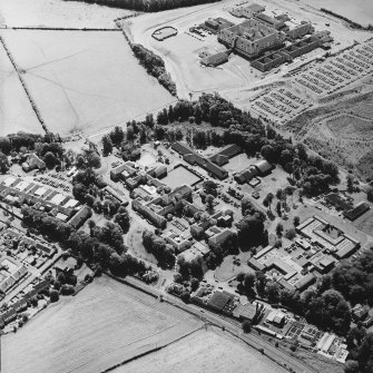 Oblique aerial view centred on the hospital, with the hospital adjacent, taken from the N.