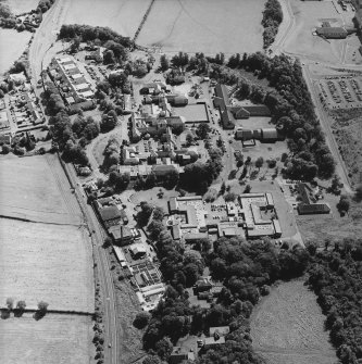Oblique aerial view centred on the hospital, taken from the NW.