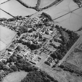 Oblique aerial view centred on the hospital, taken from the W.