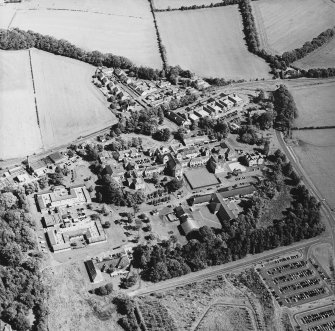 Oblique aerial view centred on the hospital, taken from the SW.