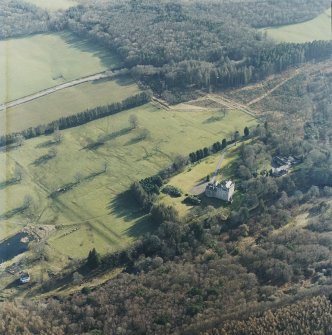 Oblique aerial view centred on the tower-house with the stables and kennels adjacent, taken from the NNW.