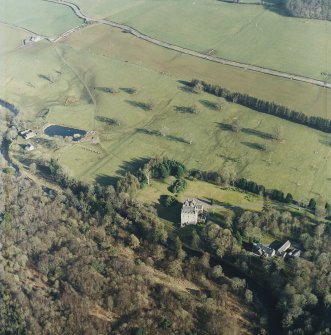 Oblique aerial view centred on the tower-house with the stables and kennels adjacent, taken from the WNW.