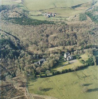 Oblique aerial view centred on the tower-house with the stables adjacent, taken from the SSE.