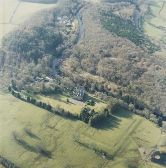 Oblique aerial view centred on the tower-house with the stables and cottage adjacent, taken from the ESE.