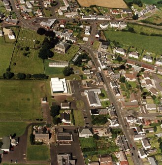 Oblique aerial view of Tarbolton centred on the church and churchyard, taken from the S.