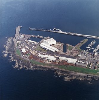 Oblique aerial view centred on the harbour, taken from the SW.