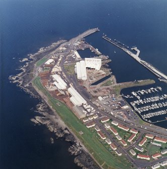 Oblique aerial view centred on the harbour, taken from the S.