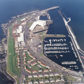 Oblique aerial view centred on the harbour, taken from the SE.
