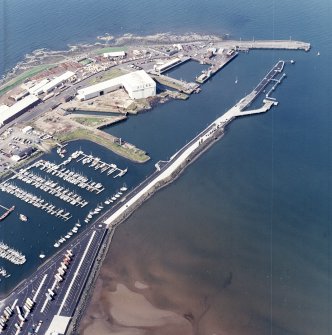 Oblique aerial view centred on the harbour, taken from the E.