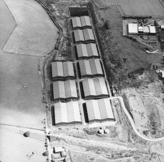 Oblique Oblique aerial view centred on the whisky distillery, with the remains of the chapel adjacent, taken from the WSW.