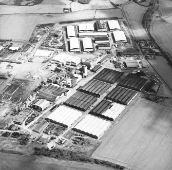 Oblique aerial view centred on the whisky distillery, taken from the SW.