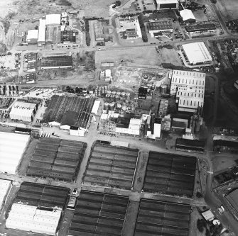 Oblique aerial view centred on the whisky distillery, taken from the S.